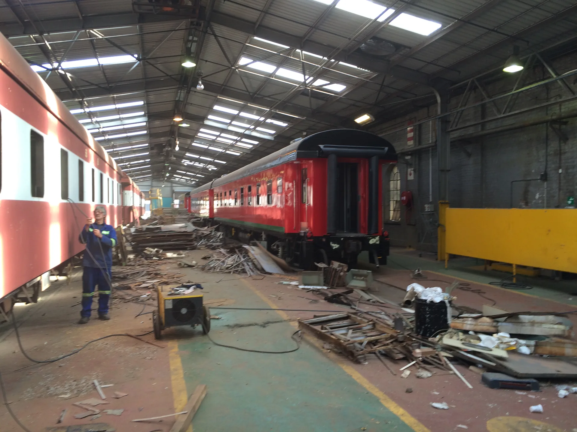 CFB Angola coach interior strip-out — debris removal during refurbishment
