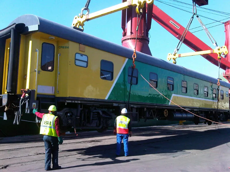 CFB314 passenger coach crane lift — side view during vessel loading for Angola