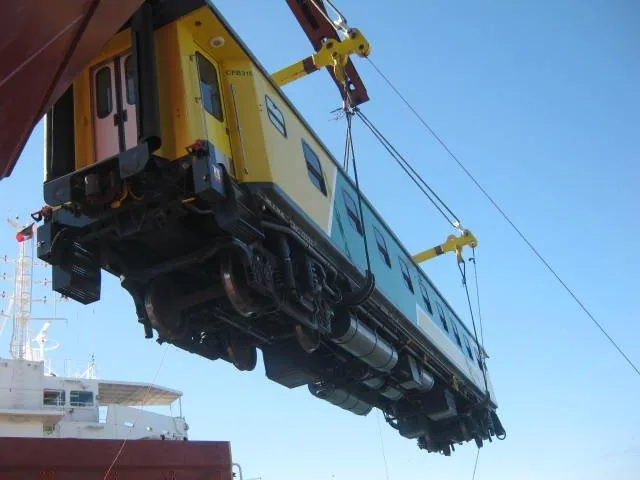 CFB315 passenger coach crane lift — undercarriage view during vessel loading Angola