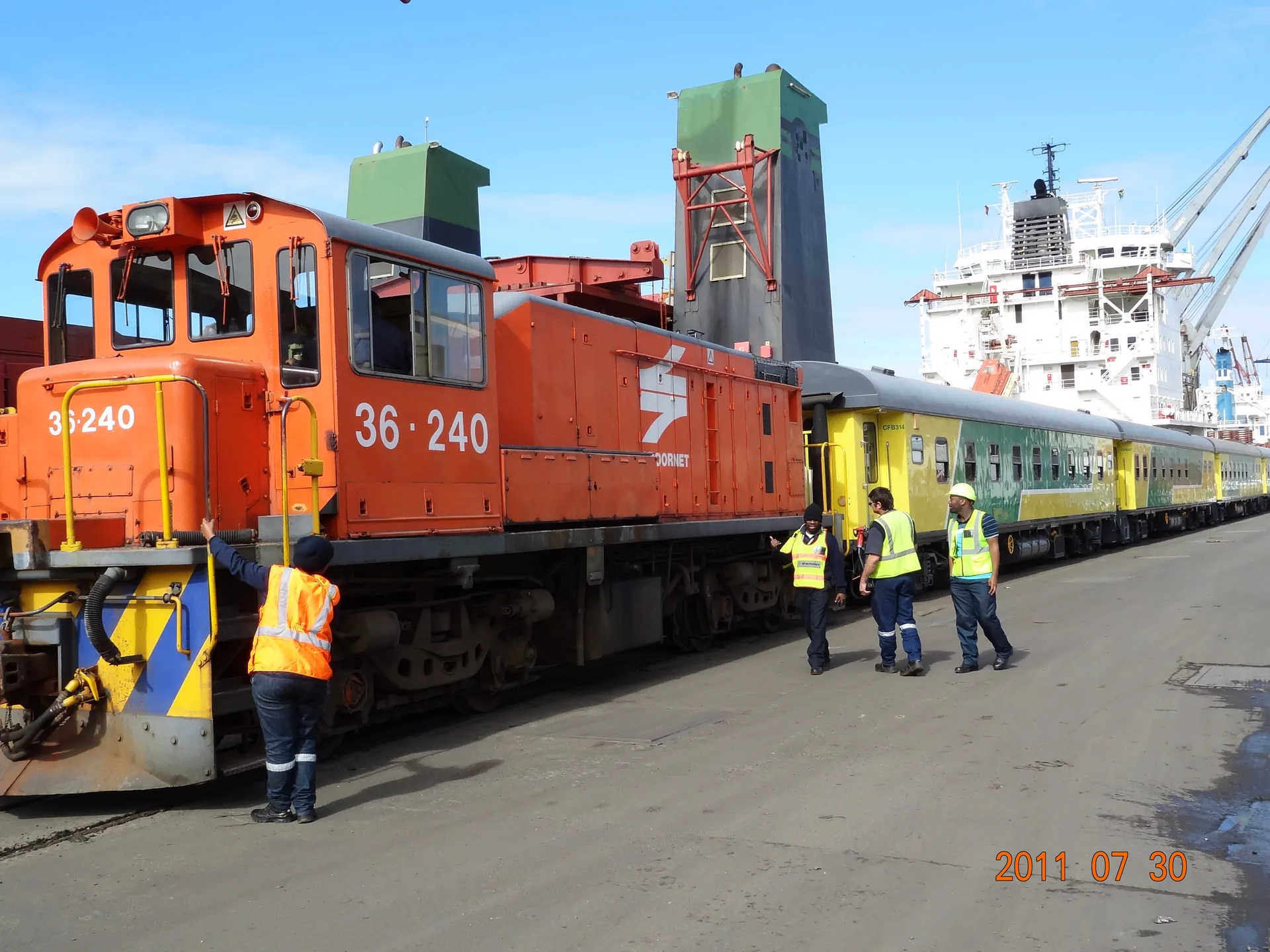 Locomotive 36240 and CFB Angola coaches loaded on vessel at Durban port